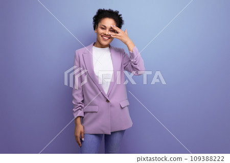 young successful hispanic brunette leader woman dressed in jacket on studio background with copy 109388222