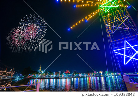 Colorful lights in the outdoor amusement park at night, Temple fair is an annual traditional festival, There is a place for religious ceremonies, Thai traditional food, and a local theme park. Colorful lights in the outdoor amusement park at night, Temple fair is an annual traditional festival, There is a place for religious ceremonies, Thai traditional food, and a local theme park. 109388848