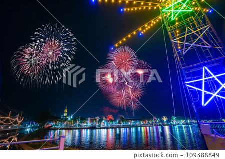 Colorful lights in the outdoor amusement park at night, Temple fair is an annual traditional festival, There is a place for religious ceremonies, Thai traditional food, and a local theme park. Colorful lights in the outdoor amusement park at night, Temple fair is an annual traditional festival, There is a place for religious ceremonies, Thai traditional food, and a local theme park. 109388849
