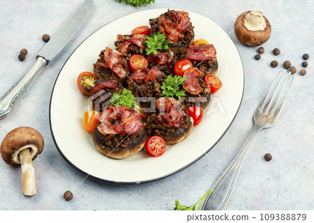Stuffed mushrooms caps on plate. Stuffed mushrooms caps on plate. 109388879