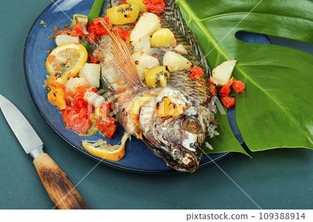 Roasted whole tilapia with citrus sauce. Roasted whole tilapia with citrus sauce. 109388914