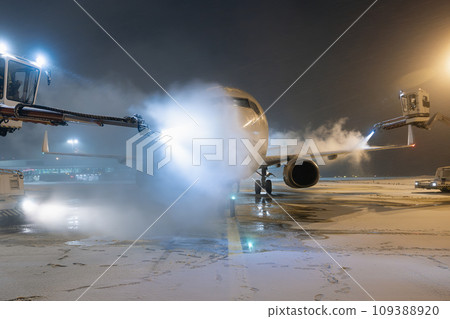 Deicing of airplane at airport. 109388920