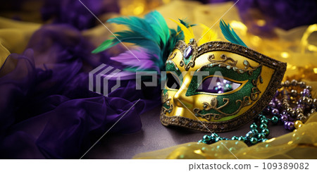 Mardi gras carnival concept - green, yellow and purple mask with decorations 109389082