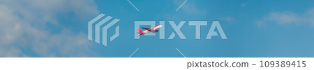 Airplane Of Airlines Flying In cloudy Sky panorama 109389415