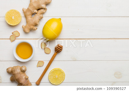 Natural cold and flu home remedies. Natural ingredients for immunity stimulation and viruses protection. top view flat lay Natural cold and flu home remedies. Natural ingredients for immunity stimulation and viruses protection. top view flat lay 109390327