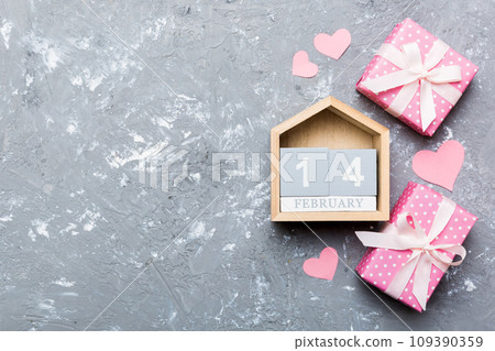 Valentine Day theme with wooden block calendar. Greeting card template for Valentines Day copy space for text 109390359
