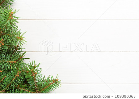 Christmas wooden background with fir tree. Top view with copy space for your text 109390363