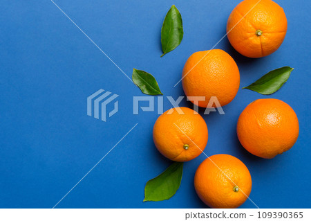fresh Fruit orange slices on colored background. Top view. Copy Space. creative summer concept. Half of citrus in minimal flat lay with copy space 109390365