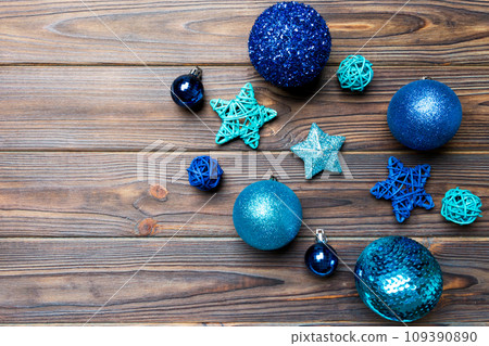 Creative set of New Year baubles and decorations on wooden background. Top view of Christmas time concept. Copy space Creative set of New Year baubles and decorations on wooden background. Top view of Christmas time concept. Copy space 109390890