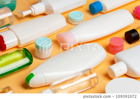 Group of plastic bodycare bottle Flat lay composition with cosmetic products on colored background empty space for you design. Set of White Cosmetic containers, top view with copy space Group of plastic bodycare bottle Flat lay composition with cosmetic products on colored background empty space for you design. Set of White Cosmetic containers, top view with copy space 109391072