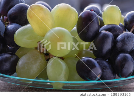 Close-up of Fresh Green seedless and Black seedless Grapes. Close-up of Fresh Green seedless and Black seedless Grapes. 109393165