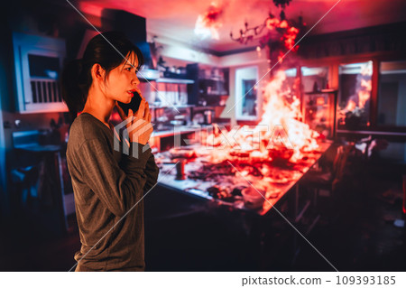 A young woman reports a fire to the fire department 109393185