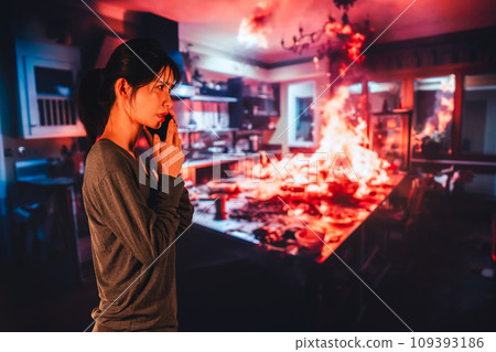 A young woman reports a fire to the fire department 109393186