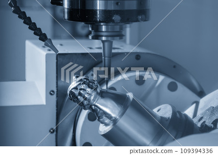 The 5-axis CNC milling machine cutting the metal part with solid ball end mill tool. The 5-axis CNC milling machine cutting the metal part with solid ball end mill tool. 109394336