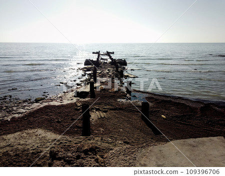 Abandoned pier in the sea. Abandoned pier in the sea. 109396706