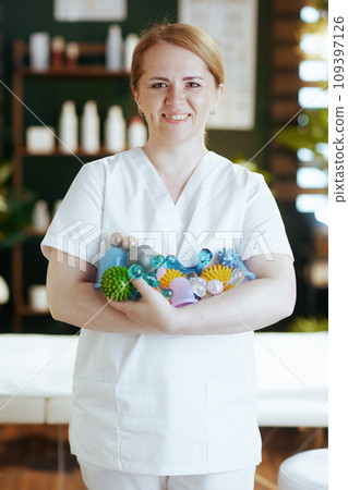happy massage therapist woman in massage cabinet 109397126
