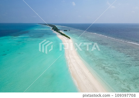 stunning blue ocean and sandy lux hotels on water top drone aeral view Maldives beach copyspace for text 109397708