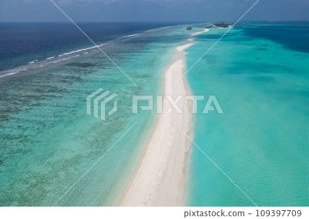 stunning blue ocean and sandy white island maldives top drone aeral view deserted hidden Maldives beach copyspace for text stunning blue ocean and sandy white island maldives top drone aeral view deserted hidden Maldives beach copyspace for text 109397709