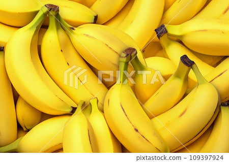 Organic yellow bananas, ripe and abundant. Freshness and nutrition in a full frame capture. Organic yellow bananas, ripe and abundant. Freshness and nutrition in a full frame capture. 109397924