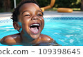 Face of a happy laughing African American boy in pool. 109398645