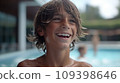 Portrait of a happy teen boy in pool. 109398646