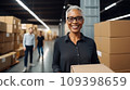 Businesswoman standing on fabric warehouse and working with papers. 109398659