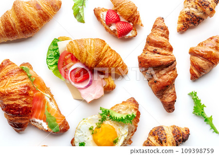 Croissant sandwich variety. Various stuffed croissants, overhead flat lay Croissant sandwich variety. Various stuffed croissants, overhead flat lay 109398759