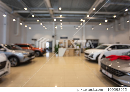 Blurred new car parked in modern showroom waiting for sales. Blurred new car parked in modern showroom waiting for sales. 109398955