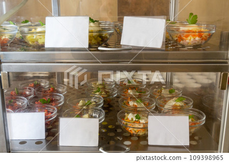 Plates with various pastries in the cafeteria window. Plates with various pastries in the cafeteria window. 109398965