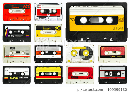 old audio cassette collection on a white 109399180