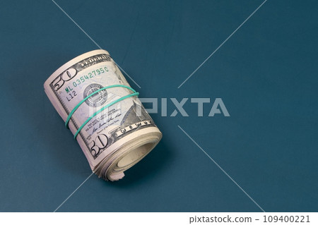 A lot of money, 50 dollar bills, American dollars, fifty dollar banknotes on a dark background 109400221