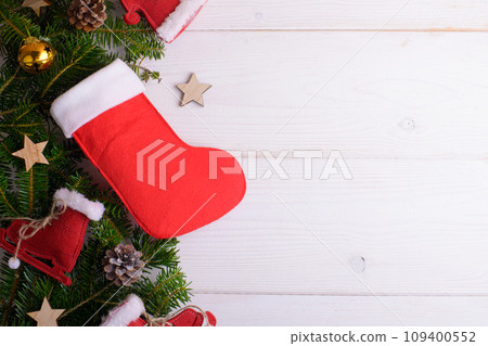 Red Christmas stockings on a white wooden background, Sinterklaas Saint Nicholas Day 109400552