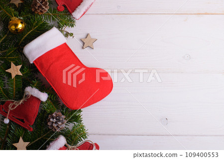 Red Christmas stockings on a white wooden background, Sinterklaas Saint Nicholas Day 109400553