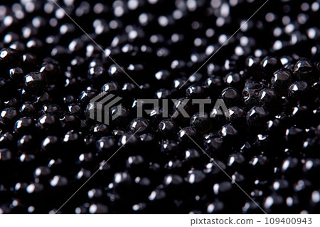 Closeup of natural black caviar as background, texture of expensive luxury fresh sturgeon caviar macro photo. Closeup of natural black caviar as background, texture of expensive luxury fresh sturgeon caviar macro photo. 109400943
