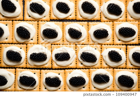 Closeup of natural black caviar served on crackers on black background, texture of fresh sturgeon caviar macro photo. 109400947