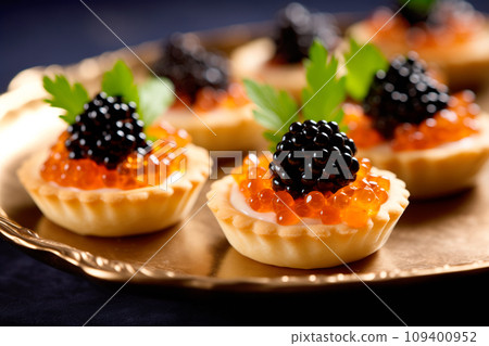 Closeup of natural black caviar served on crackers on black background, texture of fresh sturgeon caviar macro photo. Closeup of natural black caviar served on crackers on black background, texture of fresh sturgeon caviar macro photo. 109400952
