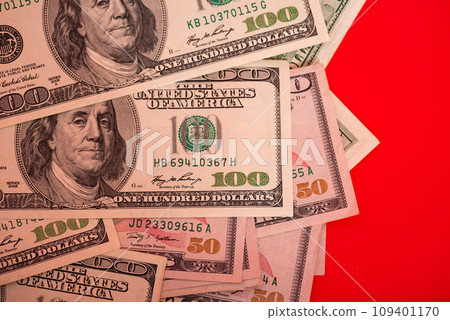 Dollars on a red background. Banks and financial concept. American currency, cash. 109401170