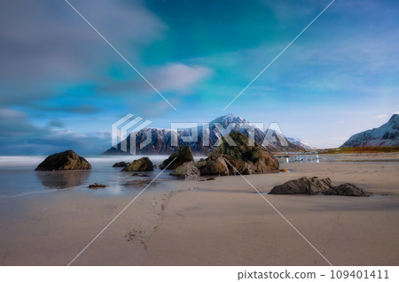 Skagsanden beach on Lofoten Islands, Norway. Aurora Borealis. Stars and northern light Skagsanden beach on Lofoten Islands, Norway. Aurora Borealis. Stars and northern light 109401411