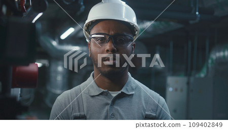 African American professional engineer looks at camera African American professional engineer looks at camera 109402849