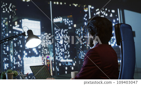 Investment banking analyst evaluating fiscal projections and managing funding deals to support expanding company on global scale. Skilled consultant seeks to boost earnings, admiring metropolis view. Investment banking analyst evaluating fiscal projections and managing funding deals to support expanding company on global scale. Skilled consultant seeks to boost earnings, admiring metropolis view. 109403047