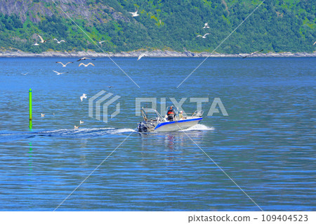 Norwegian Sea Fishing: Fishermen on an Aluminum Boat Amidst the Majestic Waters Norwegian Sea Fishing: Fishermen on an Aluminum Boat Amidst the Majestic Waters 109404523