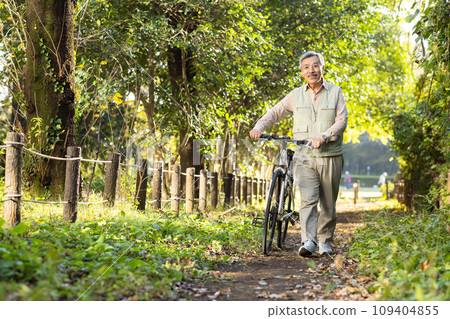 Senior man taking a walk in the park Senior man taking a walk in the park 109404855