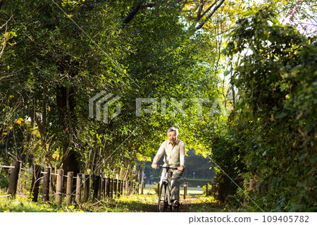 Senior man taking a walk in the park Senior man taking a walk in the park 109405782