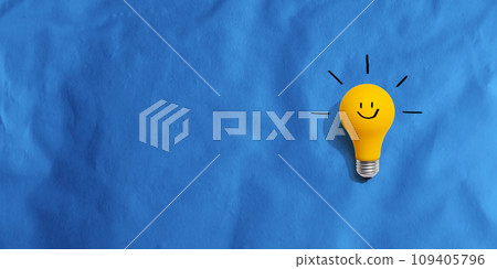 Yellow light bulb with happy face Yellow light bulb with happy face 109405796