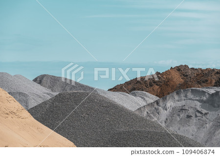 Blue sky and aggregate yard 109406874