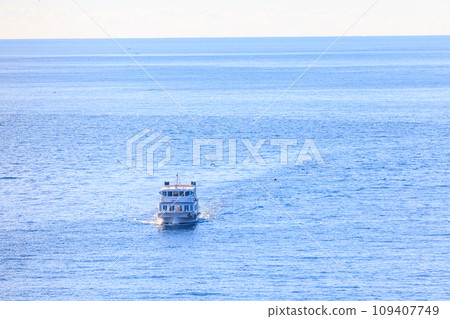 Pleasure boat in Numazu Port floating on the sea Pleasure boat in Numazu Port floating on the sea 109407749