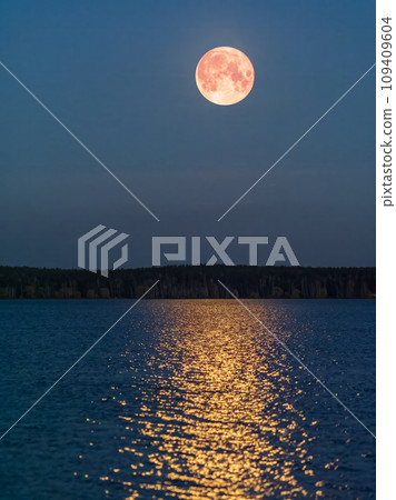 Super full blood moon and moon light over the night lake Super full blood moon and moon light over the night lake 109409604