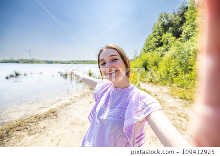 Lake Day Delight: Inviting Gesture on the Shore Lake Day Delight: Inviting Gesture on the Shore 109412925