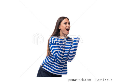 young cute slender brunette lady with straight hair is dressed in a blue striped sailor jacket young cute slender brunette lady with straight hair is dressed in a blue striped sailor jacket 109413507
