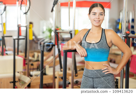 Young woman posing in pilates studio Young woman posing in pilates studio 109413620